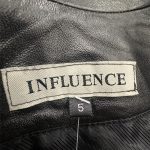 trench cuir noir influence seconde main friperie en ligne
